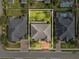 Aerial view of the property showcasing a spacious backyard and surrounding homes at 3667 Arbor Chase Dr, Palm Harbor, FL 34683