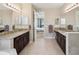 Bathroom features double vanities, granite countertops and tiled floors at 3667 Arbor Chase Dr, Palm Harbor, FL 34683