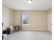 Bedroom with neutral walls, carpet, and a window overlooking the front yard at 3667 Arbor Chase Dr, Palm Harbor, FL 34683