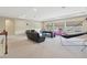 Spacious bonus room with a pool table, lounge seating, and plenty of space for activities at 3667 Arbor Chase Dr, Palm Harbor, FL 34683