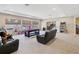 Spacious bonus room with a pool table, lounge seating, and plenty of space for games and entertainment at 3667 Arbor Chase Dr, Palm Harbor, FL 34683