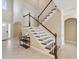 Foyer features stairs with white railing, an open floor plan, and tile flooring at 3667 Arbor Chase Dr, Palm Harbor, FL 34683