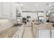 Kitchen features stainless appliances, granite countertops and tile backsplash at 3667 Arbor Chase Dr, Palm Harbor, FL 34683