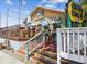 Outdoor dining at a restaurant with colorful decor at 3667 Arbor Chase Dr, Palm Harbor, FL 34683
