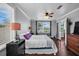 Cozy bedroom with bright natural light, a ceiling fan, and hardwood floors, complemented by stylish furnishings at 3727 38Th N St, St Petersburg, FL 33713