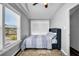 Cozy bedroom featuring carpet, a single bed, and an abundance of natural light through the windows at 3727 38Th N St, St Petersburg, FL 33713