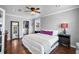 Bright bedroom with hardwood floors, a ceiling fan, a walk-in closet, and windows for natural light at 3727 38Th N St, St Petersburg, FL 33713