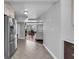Hallway featuring a view into the living room with lots of light and an open design concept at 3727 38Th N St, St Petersburg, FL 33713