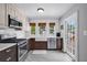 Beautiful kitchen with stainless steel appliances, white cabinets, tiled backsplash, and ample counter space at 3727 38Th N St, St Petersburg, FL 33713