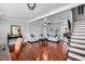 Spacious living room with hardwood floors, modern decor, and staircase leading to the home's upper level at 3727 38Th N St, St Petersburg, FL 33713