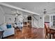 Open living room with hardwood floors, modern decor, and staircase with easy access to other parts of home at 3727 38Th N St, St Petersburg, FL 33713