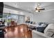 Elegant living room featuring hardwood floors, modern lighting fixtures, and comfortable seating arrangement at 3727 38Th N St, St Petersburg, FL 33713