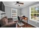 Home office with a vintage desk, a comfortable couch, natural light, and hardwood flooring at 3727 38Th N St, St Petersburg, FL 33713
