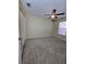 Comfortable bedroom featuring neutral carpet, a ceiling fan, and a closet for storage at 4224 Winding River Way, Land O Lakes, FL 34639