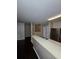 Kitchen featuring stainless steel appliances, a double sink, and an open layout to the living room at 4224 Winding River Way, Land O Lakes, FL 34639