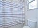 Bathroom with a shower curtain, providing functionality at 4627 Tramanto Ln, Wesley Chapel, FL 33543