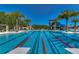 Large community pool with lap lanes and slide at 4627 Tramanto Ln, Wesley Chapel, FL 33543