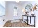 Inviting foyer with stylish tile flooring, elegant decor, and plenty of natural light at 4627 Tramanto Ln, Wesley Chapel, FL 33543