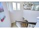 Bright staircase with carpeted steps, white railing, and decorative chandelier at 4627 Tramanto Ln, Wesley Chapel, FL 33543