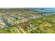 Stunning aerial view showcases waterfront homes and community in a beautiful Tampa Bay setting at 4707 Troydale Rd, Tampa, FL 33615