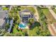 Charming exterior with a pool, lush landscaping, covered patio, private roof deck with spiral staircase at 4707 Troydale Rd, Tampa, FL 33615