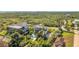 A luxurious home with a private screened-in patio and pool, nestled amidst lush tropical landscaping and greenery at 4707 Troydale Rd, Tampa, FL 33615