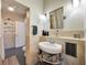 Charming bathroom showcasing beautiful tile work, vintage sink and fixtures at 4707 Troydale Rd, Tampa, FL 33615