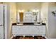 Bathroom featuring dual sinks, tile floors and granite countertops at 4707 Troydale Rd, Tampa, FL 33615
