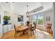 Elegant dining room features a tray ceiling, stylish lighting, and ample natural light at 4707 Troydale Rd, Tampa, FL 33615