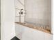 Custom dog bath with mosaic tile floor and tiled walls at 4707 Troydale Rd, Tampa, FL 33615