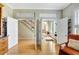 Inviting entryway with open doors, hardwood floors, and staircase leading to the second floor at 4707 Troydale Rd, Tampa, FL 33615