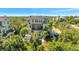 Stunning exterior elevation features a pool, outdoor deck, spiral staircase, and private rooftop deck at 4707 Troydale Rd, Tampa, FL 33615