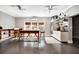 Spacious flex room featuring light gray walls, custom shelving, mini-kitchen and dual ceiling fans for added comfort at 4707 Troydale Rd, Tampa, FL 33615