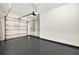 Spacious two car garage with gray epoxy floor and a custom dog bath at 4707 Troydale Rd, Tampa, FL 33615