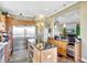 Bright kitchen featuring stainless steel appliances, central island with breakfast bar, tile floor at 4707 Troydale Rd, Tampa, FL 33615