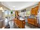 Well-lit kitchen with stainless steel appliances, granite countertops, and center island at 4707 Troydale Rd, Tampa, FL 33615