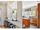 Kitchen view of island with dark countertops, breakfast bar, sink and view of the kitchen area at 4707 Troydale Rd, Tampa, FL 33615