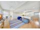 Spacious living room with hardwood floors, beanbag chairs, recessed lighting, ceiling fan, and neutral walls at 4707 Troydale Rd, Tampa, FL 33615