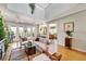 Bright and airy living room with comfortable seating, access to balcony, hardwood floors at 4707 Troydale Rd, Tampa, FL 33615