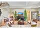 Modern living room with comfortable seating, high ceilings, and stairs in the background at 4707 Troydale Rd, Tampa, FL 33615