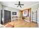 Bright office with wood floors, built-in bookshelves, cabinets, and a large desk area at 4707 Troydale Rd, Tampa, FL 33615