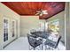 Covered patio featuring a ceiling fan and a dining table at 4707 Troydale Rd, Tampa, FL 33615