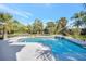 Sparkling pool with a waterfall feature and beautiful tropical surroundings at 4707 Troydale Rd, Tampa, FL 33615