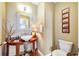 Powder room with vessel sink and decorative mirror at 4707 Troydale Rd, Tampa, FL 33615