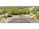 Aerial rooftop showcasing tile shingles and lush surroundings at 4707 Troydale Rd, Tampa, FL 33615