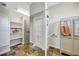 Large walk-in closet with built-in shelving and storage at 4707 Troydale Rd, Tampa, FL 33615