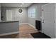 Bright dining area with luxury vinyl plank flooring and a modern entryway at 4930 S 82Nd St, Tampa, FL 33619