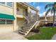 Exterior view of building with landscaped garden area and staircase to second story at 515 Bayview Ne Dr # 4, St Petersburg, FL 33704