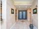 Grand foyer with tiled floors, decorative lighting, and an ornate front door at 555 5Th Ne Ave # 322, St Petersburg, FL 33701