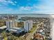 Scenic aerial view overlooking the beach and neighborhood below; perfect for water and beach lovers at 5950 Pelican Bay S Plz # Ph-2F, Gulfport, FL 33707